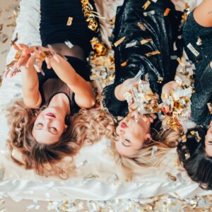 theme party women relaxing bed confetti excitement